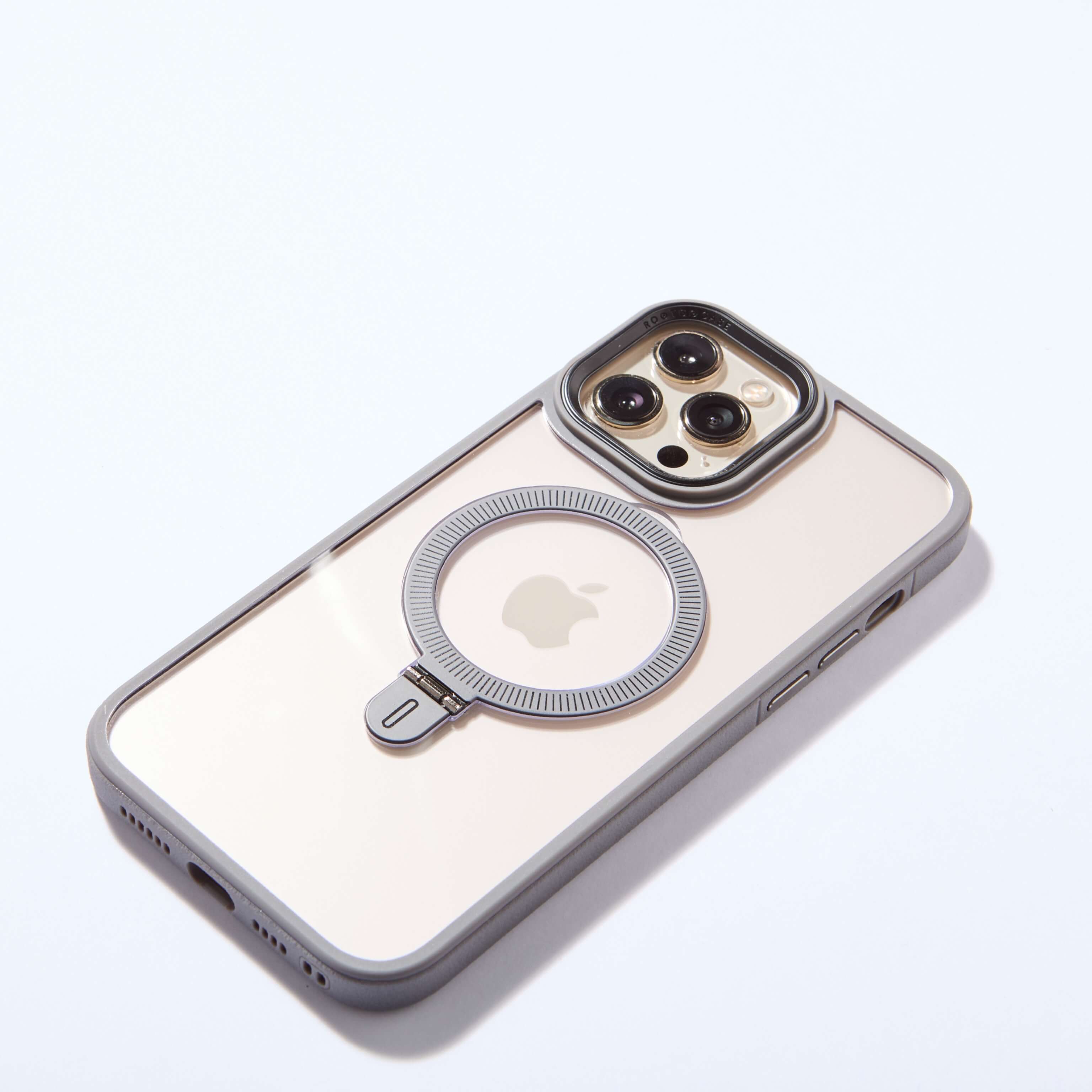 Funda MagSafe gris con anillo plegado, mostrada en posición frontal sobre fondo blanco. #color_gris